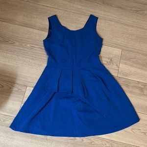 Bright blue dress with asymmetrical detailing